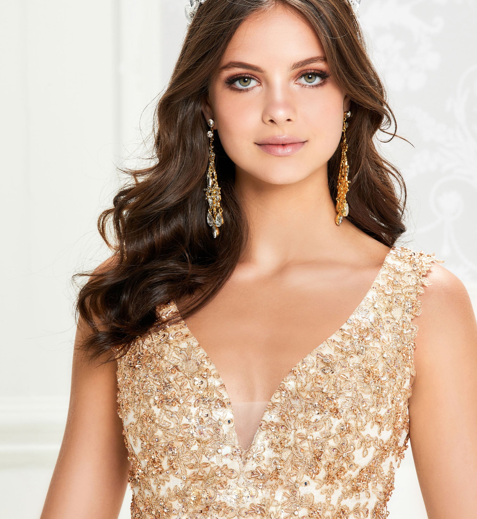 Gold quinceanera dress with lace and V-neck bodice