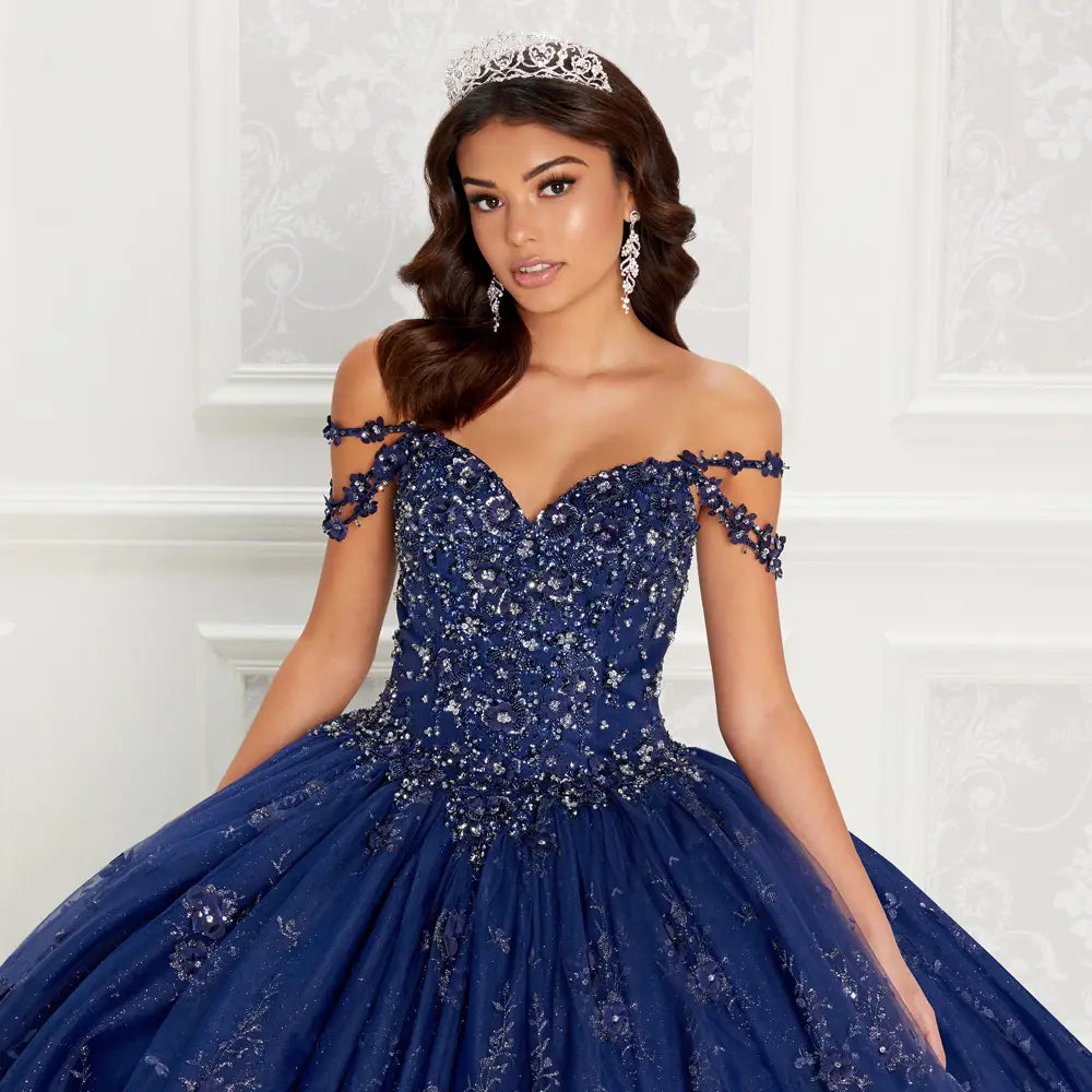 Quinceanera dress with beaded bodice and floral applique details along the hem